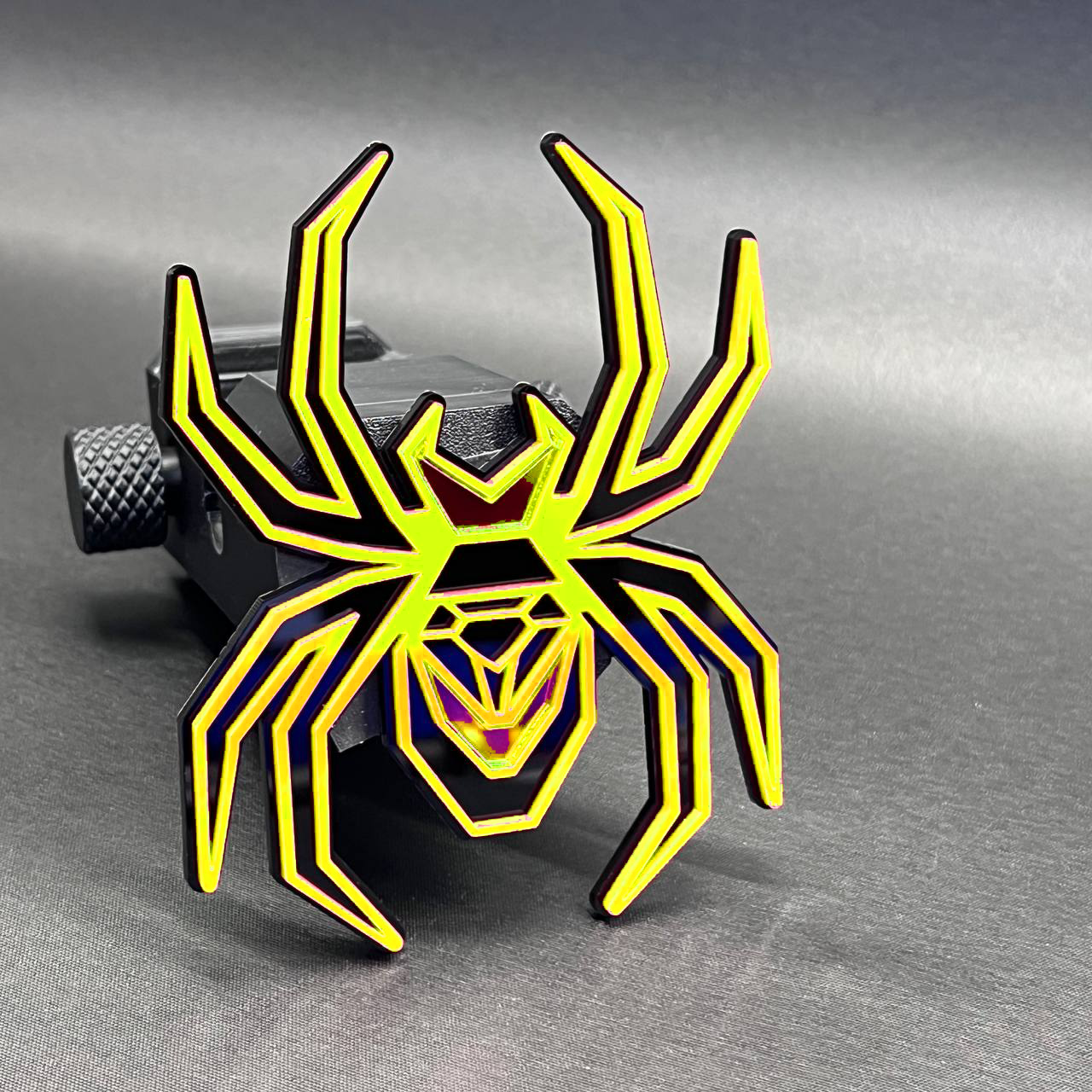 Custom Black Widow mirror red hitch cover badge for truck rear receiver styling.
