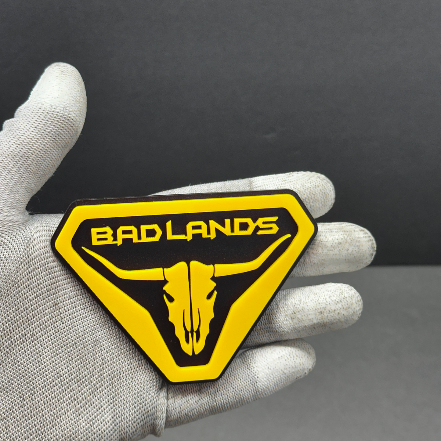 Yellow 3D acrylic Bronco Badlands skull emblem badge – adhesive fender accessory for Ford Bronco SUVs.