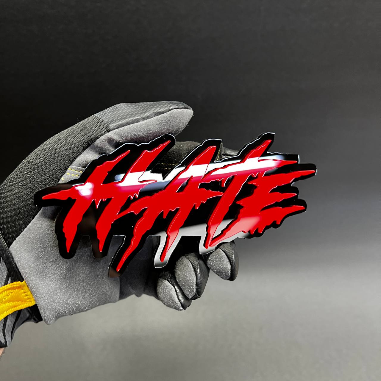 Edgy acrylic HATE emblem decal for custom vehicle, garage, or show display.