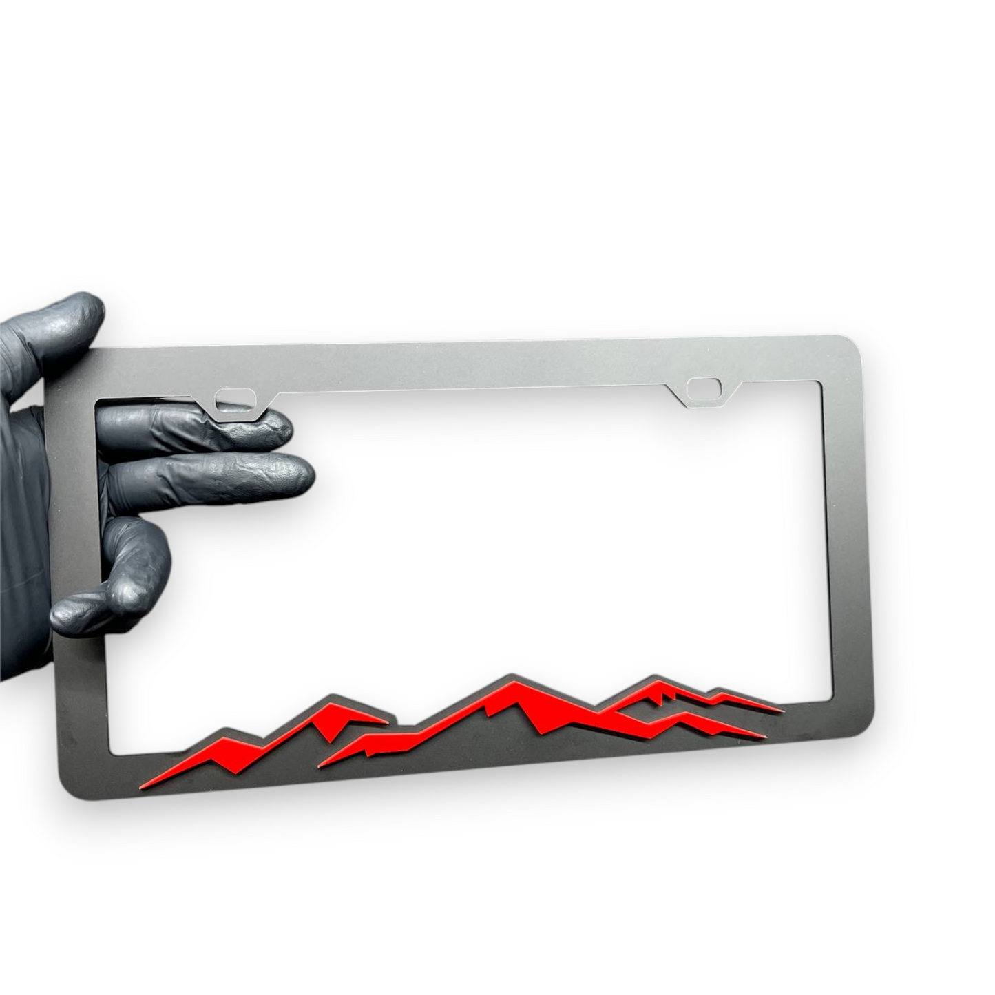 Decorative mountain license plate frame with sporty offroad inspired design