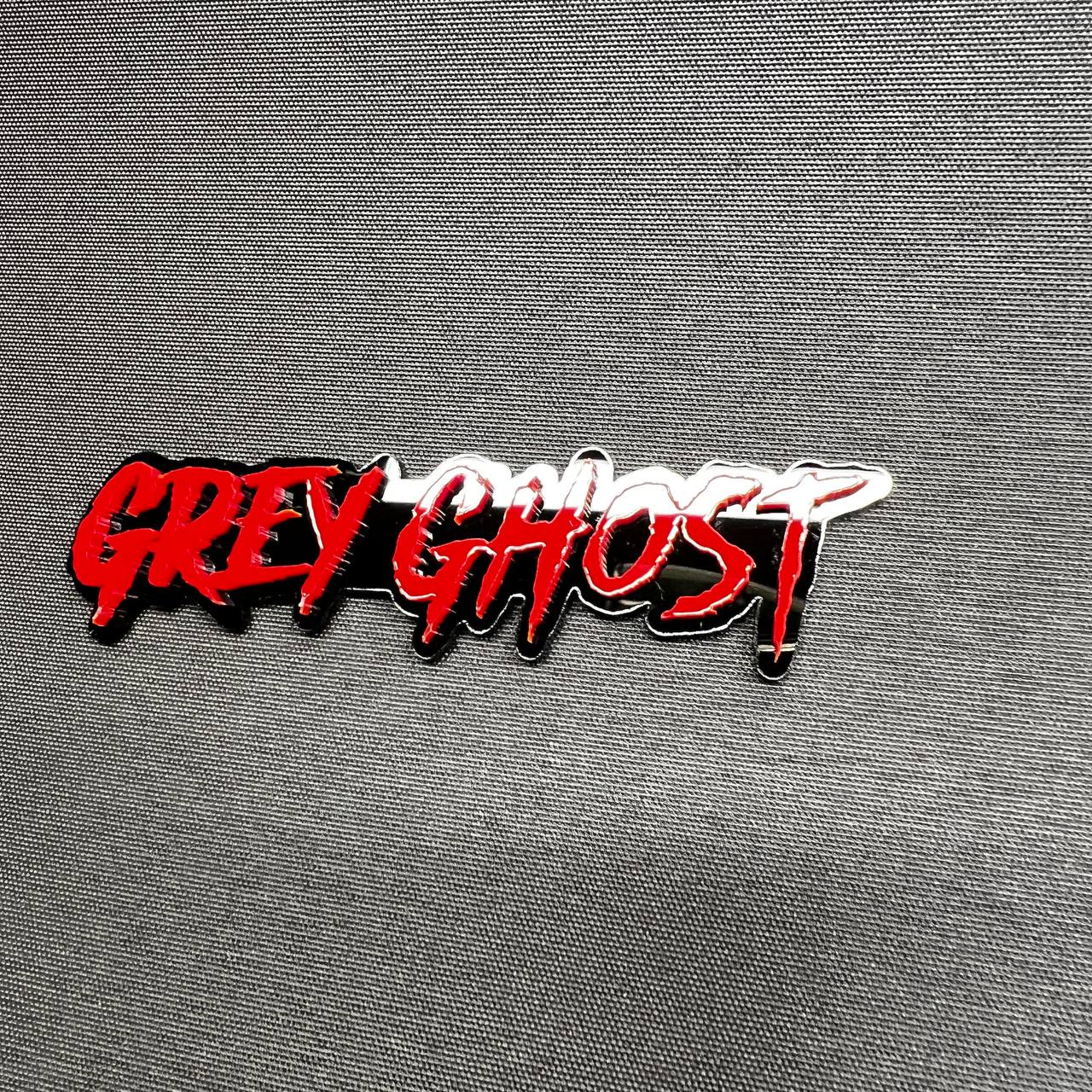 Grey Ghost custom text emblem badge made from layered acrylic with bold red finish for offroad and performance vehicle customization