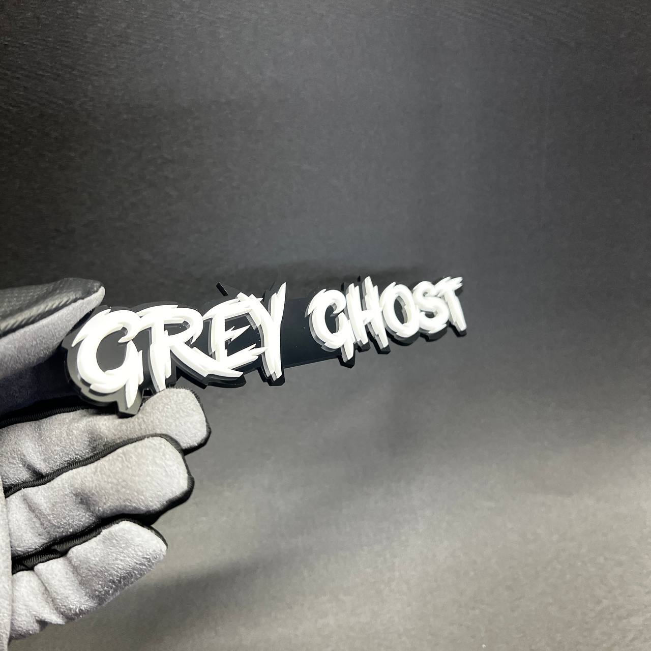 Custom Grey Ghost acrylic Car Badge Fender Emblem with bold white lettering and black backing for Dodge Charger style builds.