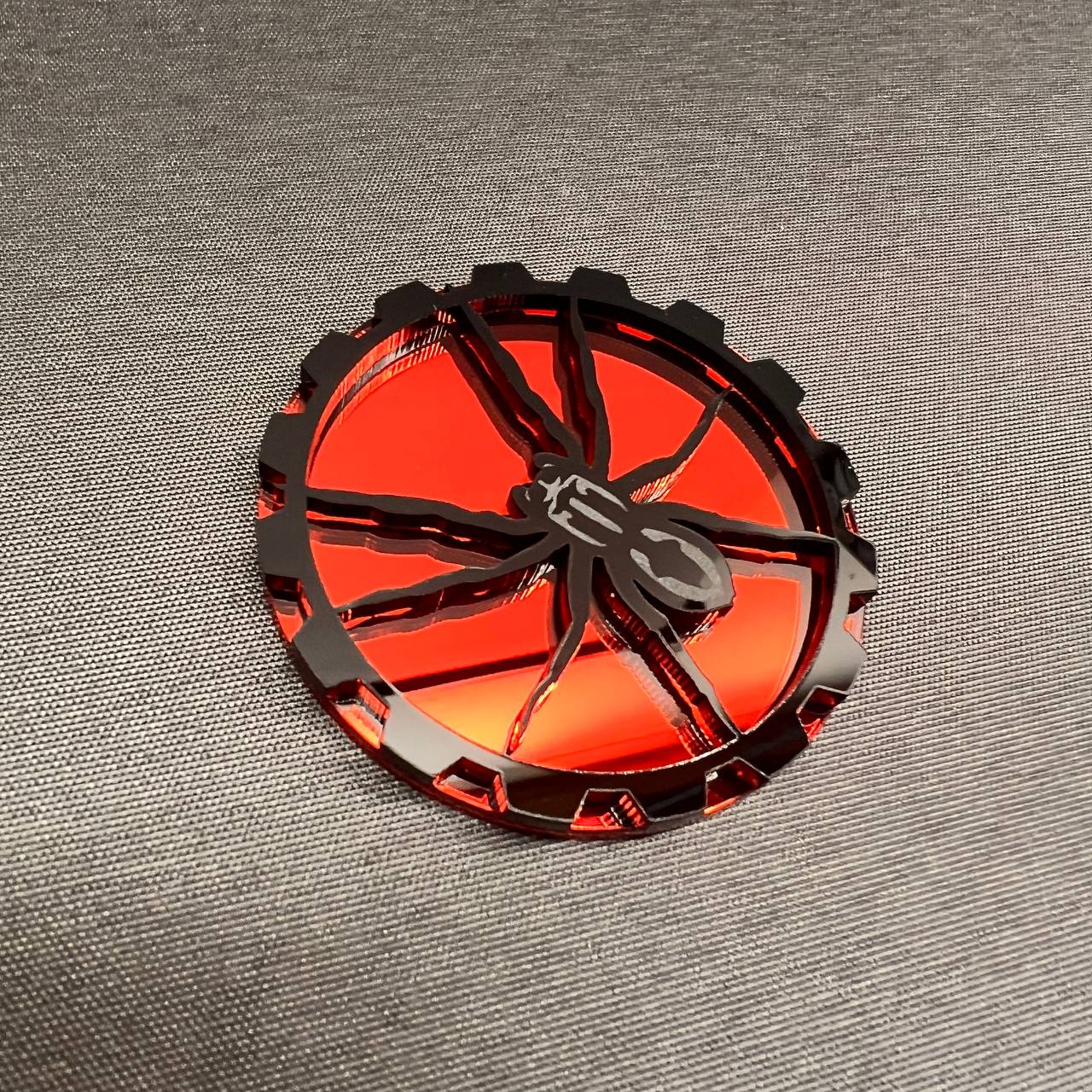 lack Widow spider design badge in red and black for Jeep vehicles