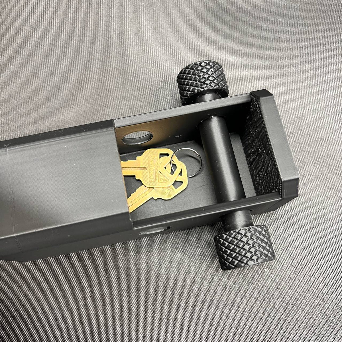 Custom lettering hitch cover mounted on truck tow receiver