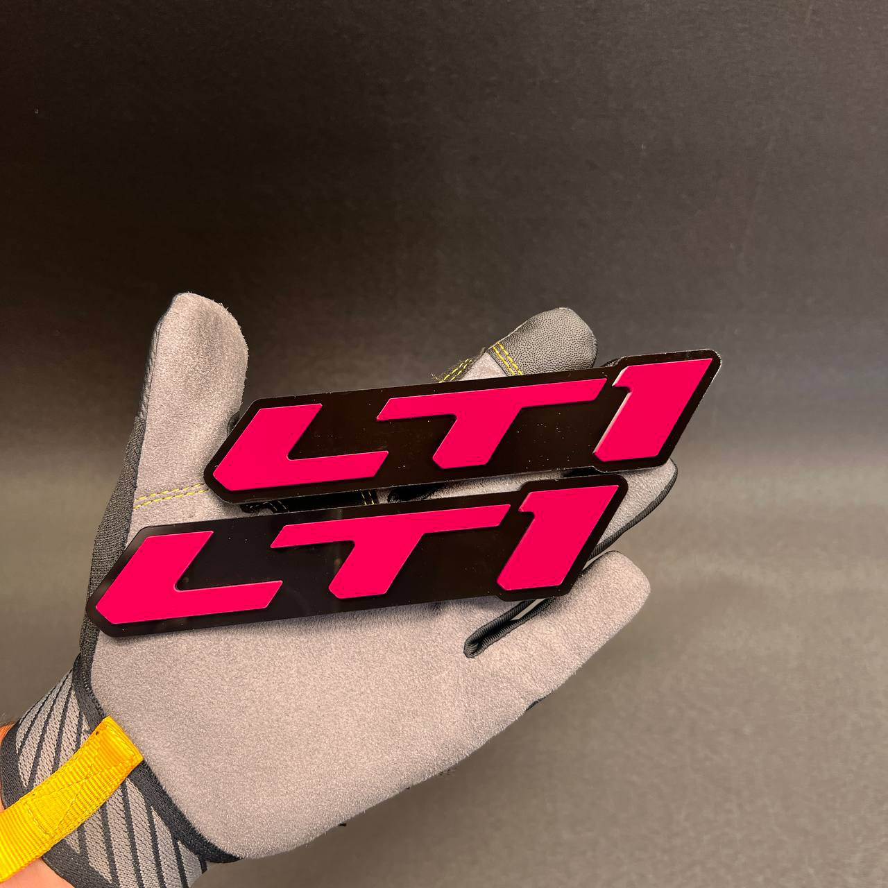 Raised red LTI car badge designed for fender, trunk, or side panel