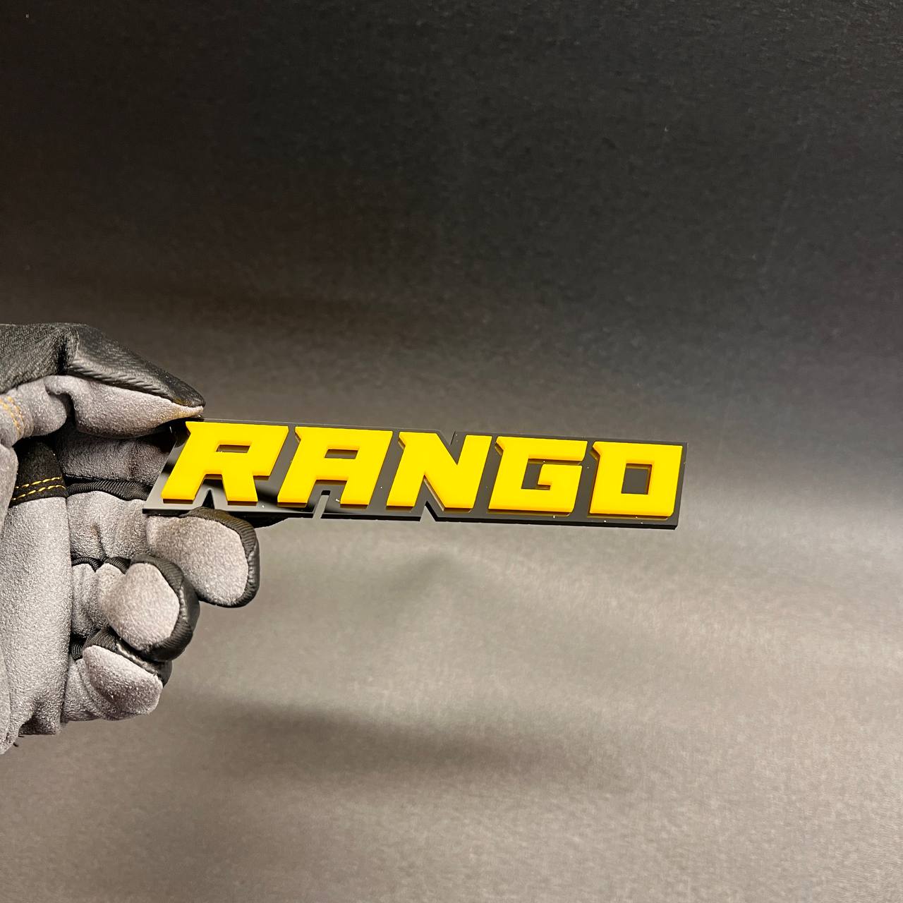 Rango personalized exterior emblem with automotive-grade adhesive backing.