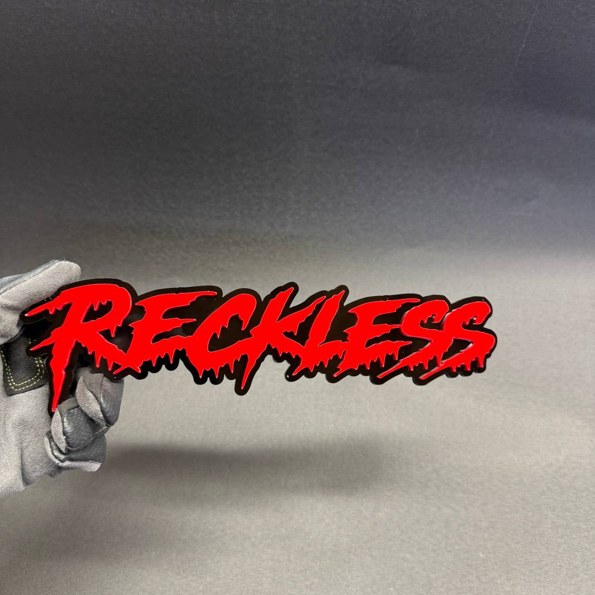 Reckless red black JDM inspired exterior car emblem for Honda Civic Type R Subaru WRX STI Toyota Supra and Lexus IS.
