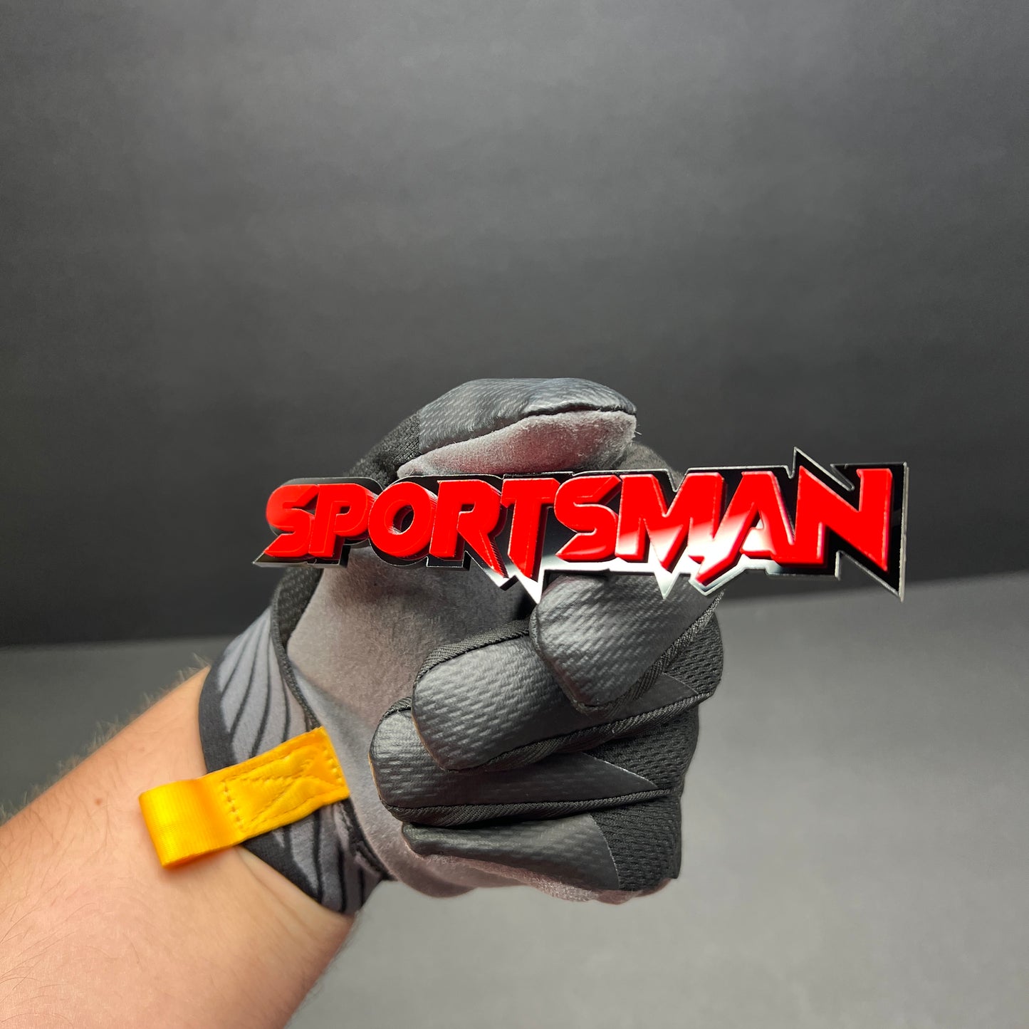 Layered red and black SPORTS MAN acrylic text badge for performance inspired custom car modification