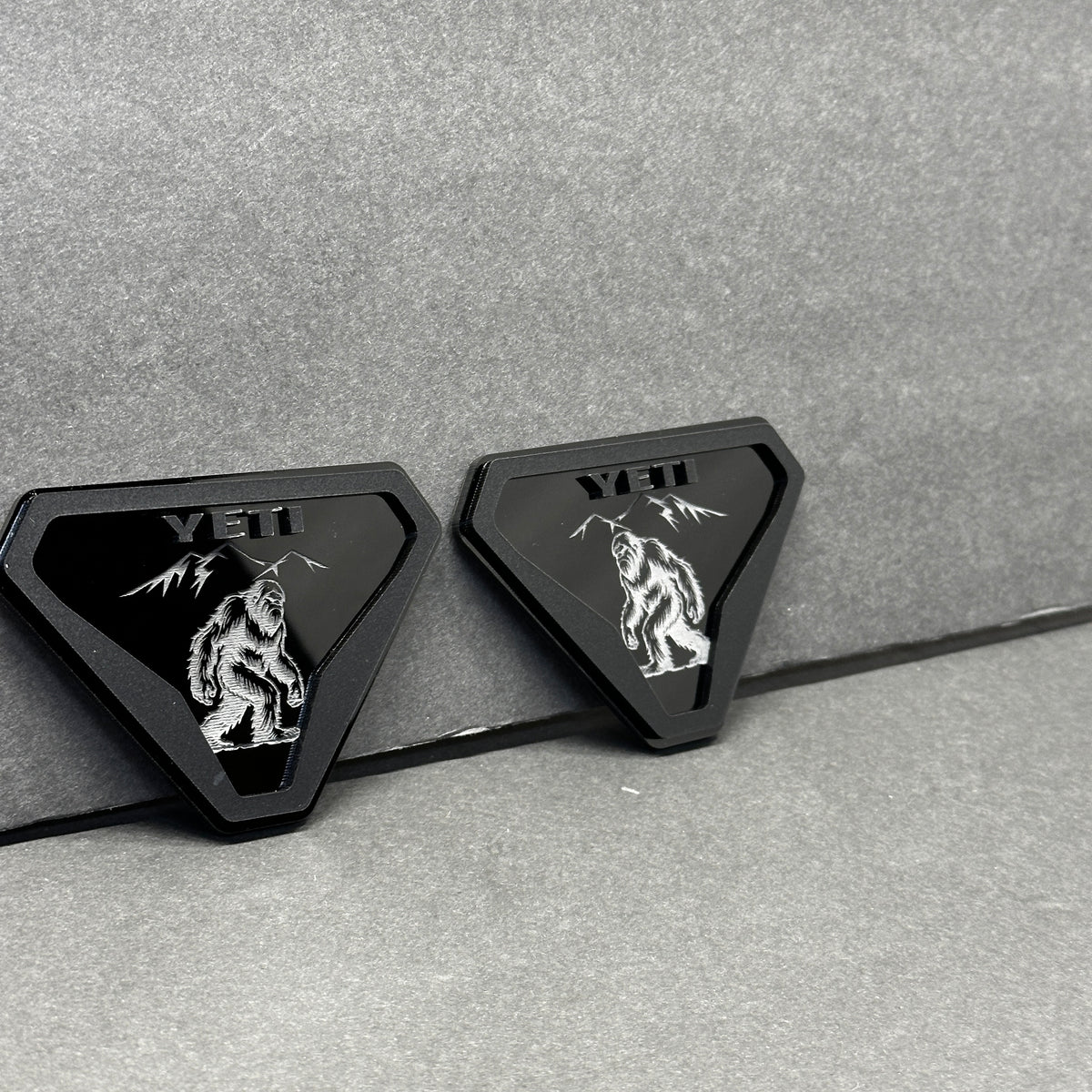 Silver black Yeti walking creature emblem with mountain design