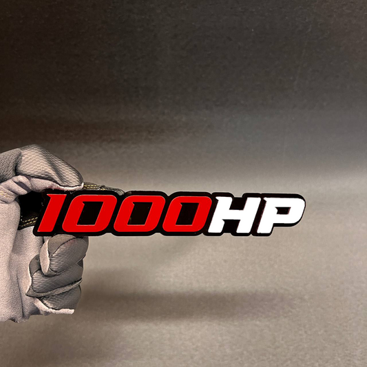 1000HP car badge fender emblem with red and white lettering on black base