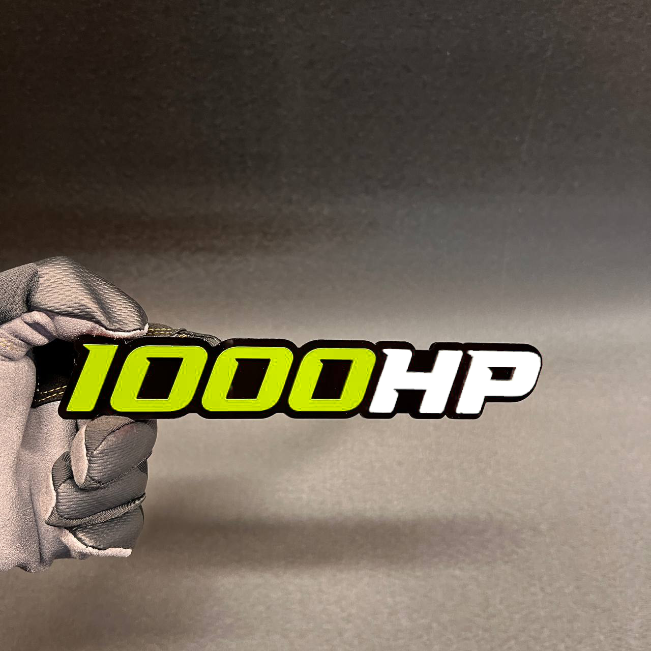Custom 1000HP horsepower car badge in red and white on black