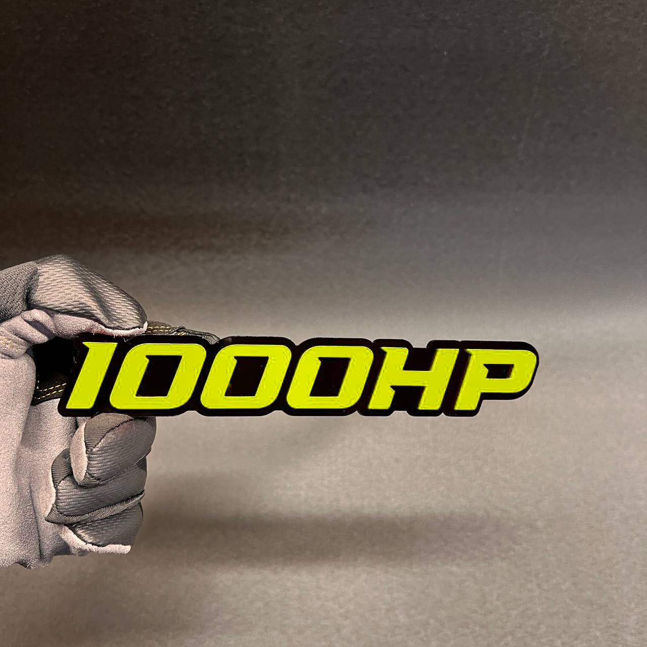 1000HP performance badge with bold red letters and black outline