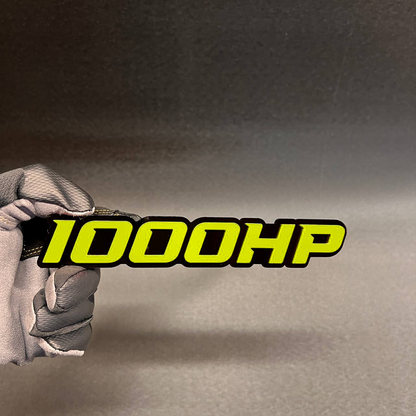 1000HP performance badge with bold red letters and black outline