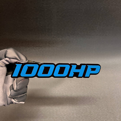 Handcrafted 1000HP horsepower badge with red top layer and black base
