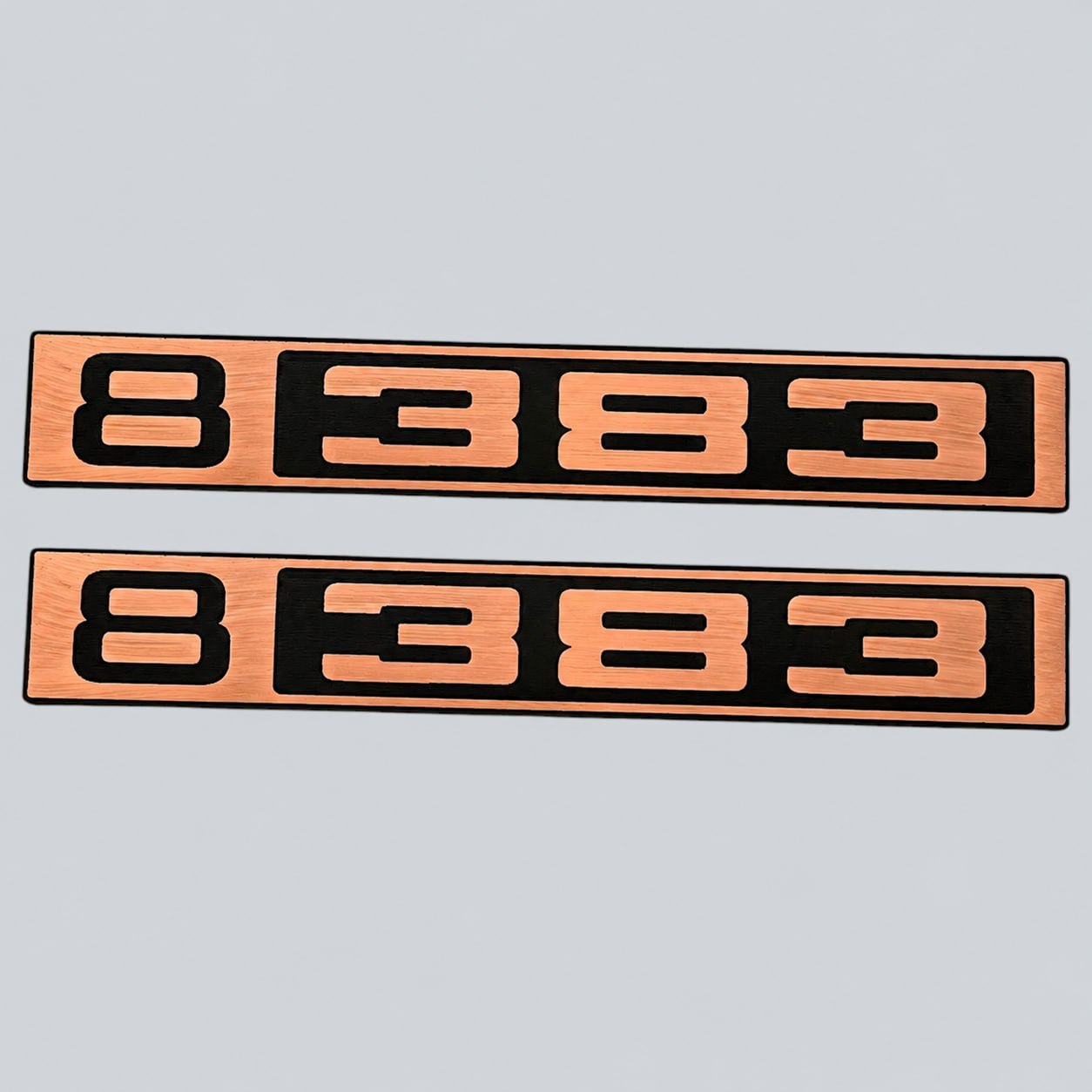 Silver and black B 383 car badge fender emblem designed for classic Chevy C10 trucks.