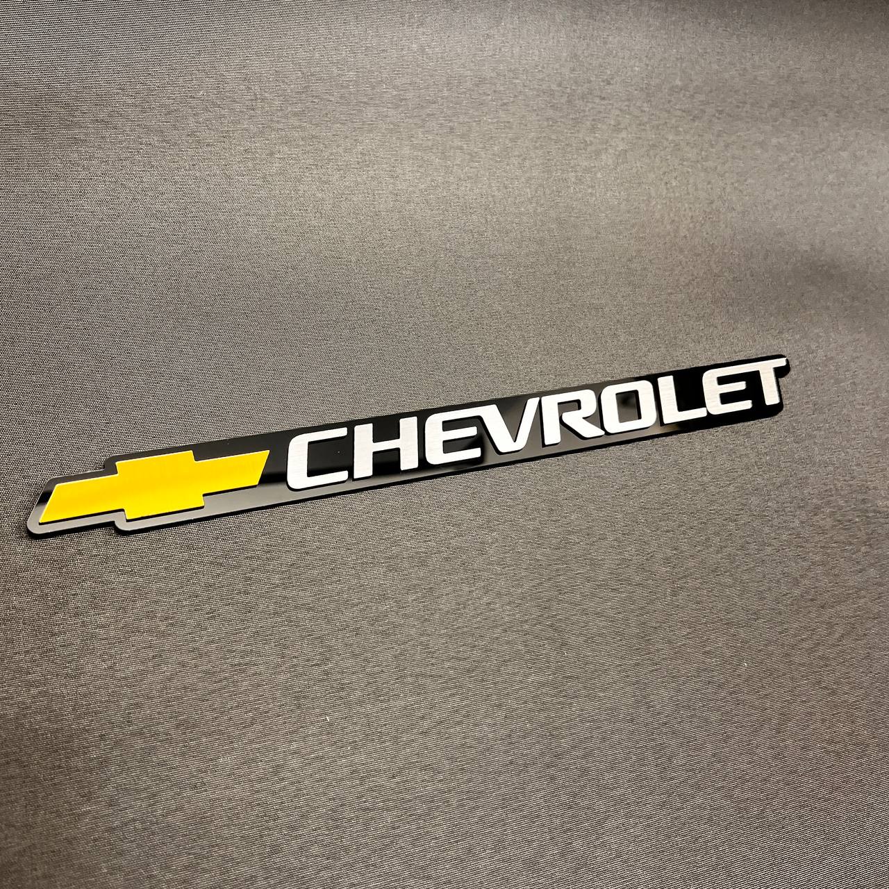 Replacement Chevy gold Bowtie and silver Chevrolet tailgate emblem compatible with 1999-2006 Chevrolet vehicles.