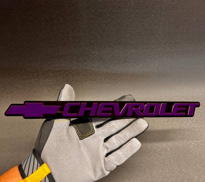 Replacement Chevrolet Bowtie tailgate emblem for Silverado, Tahoe, and Suburban 1999-2006.