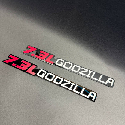 7.3L Godzilla automotive emblem for Ford F450 Super Duty with glossy black and gray background options.