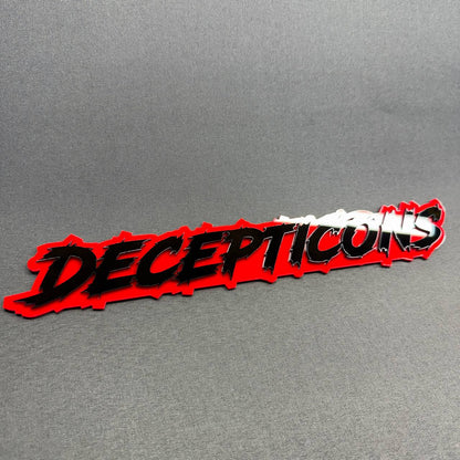 Transformers Decepticon text truck badge with jagged black typography, layered red background and custom styling for Ford Bronco Raptor.