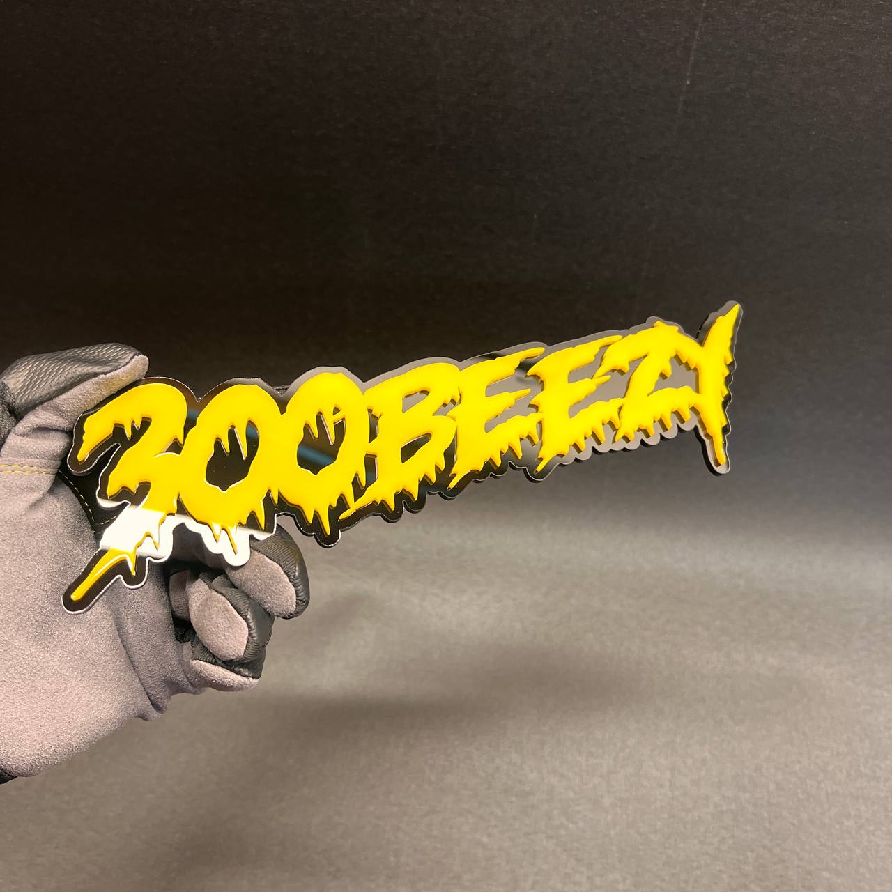 Custom 300 Beezy text car badge made from layered acrylic with 3M adhesive backing.
