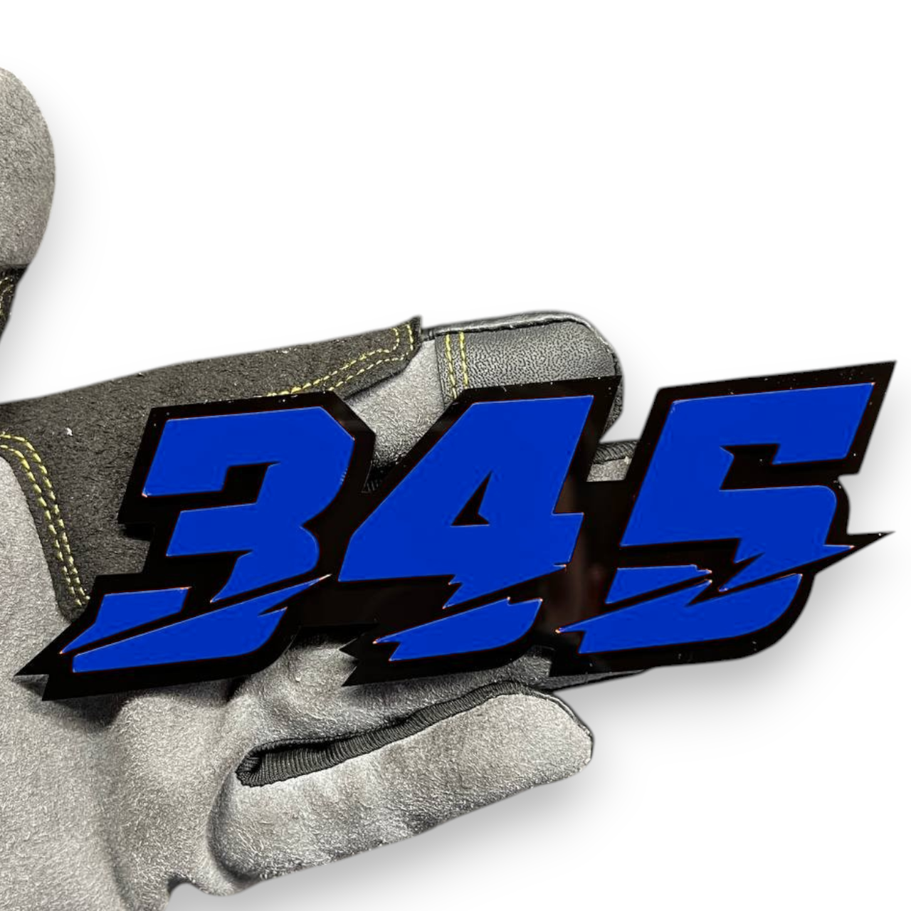 345 badge on Jeep Wrangler grille emblem
