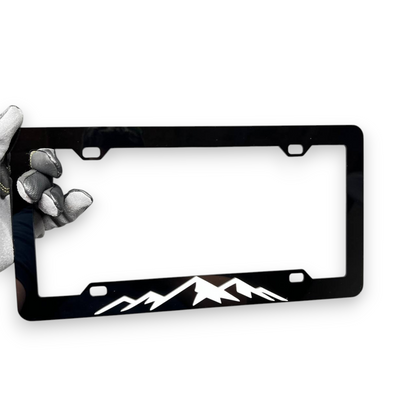 Custom mountain range license plate frame for offroad vehicle exterior styling