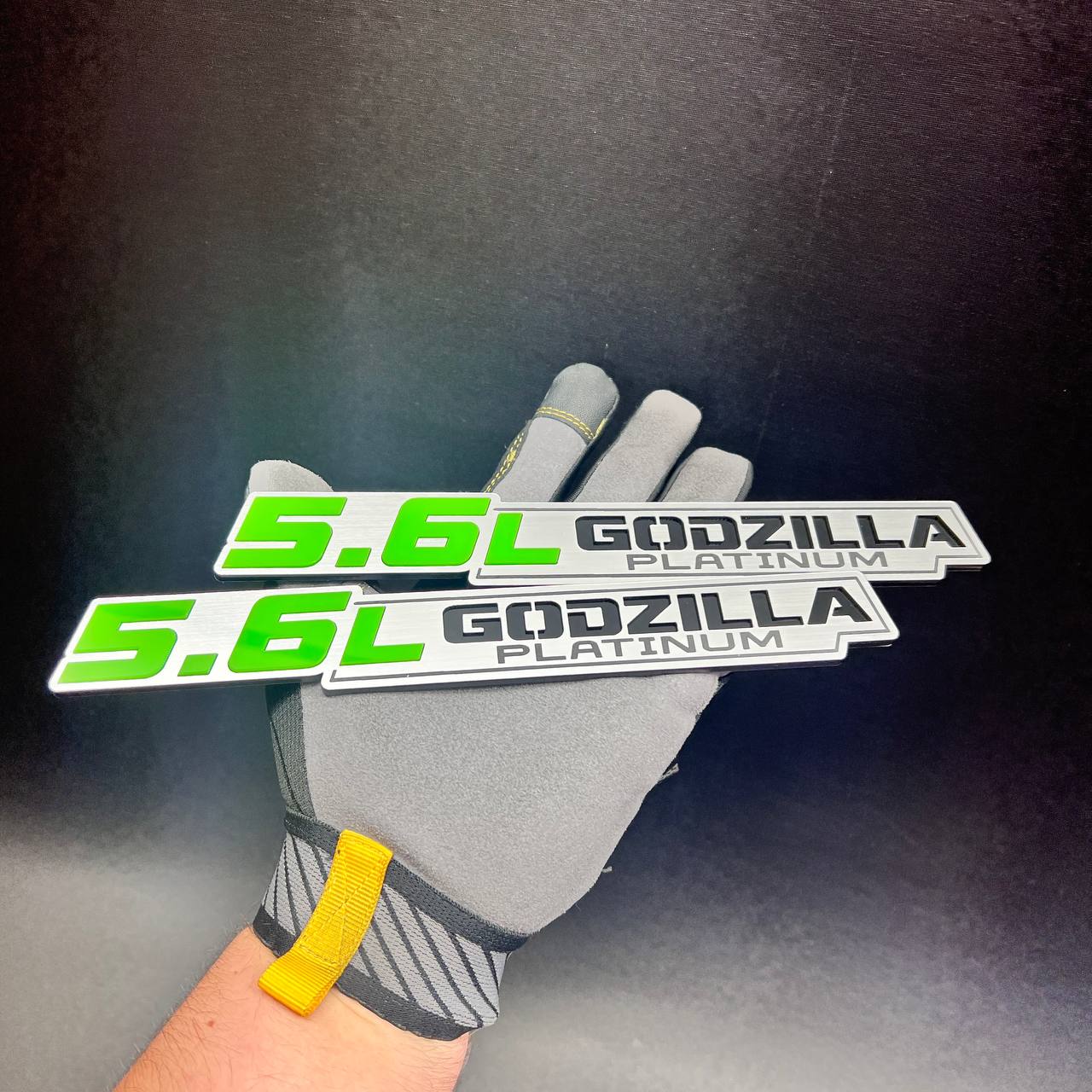 Matching set of 5.6L Godzilla Platinum truck side badges in green, silver and black