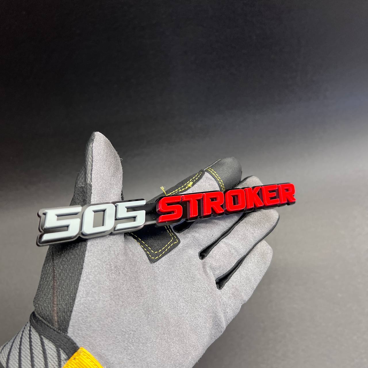 Custom 505 STROKER car badge in red and white with black outline for muscle car fender.