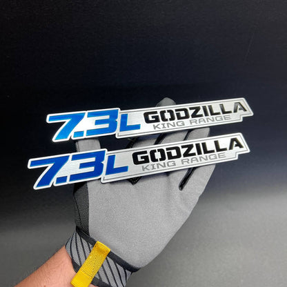Custom automotive badge with 7.3L lettering and Godzilla King Range design
