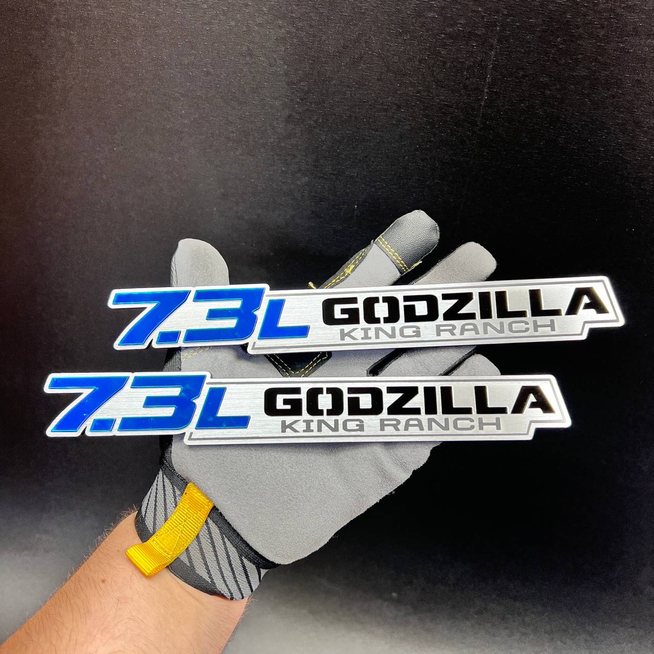7.3L Godzilla King Ranch truck badge with bold blue numbers and silver background