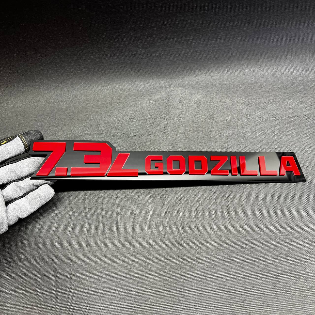 Long 7.3L Godzilla acrylic fender emblem for Ford Super Duty trucks with bold custom V8 styling.