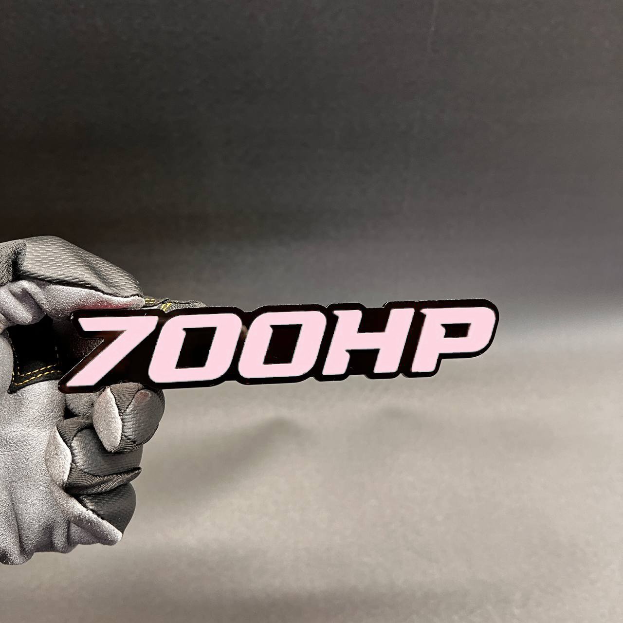 700HP performance badge with bold red letters and black outline