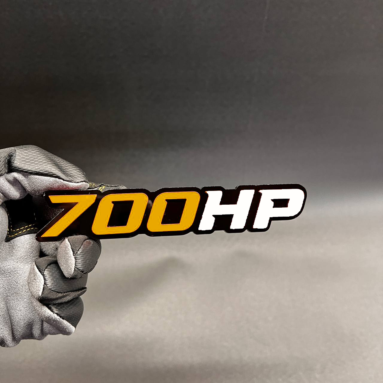 Custom 700HP horsepower car badge with light blue and white lettering
