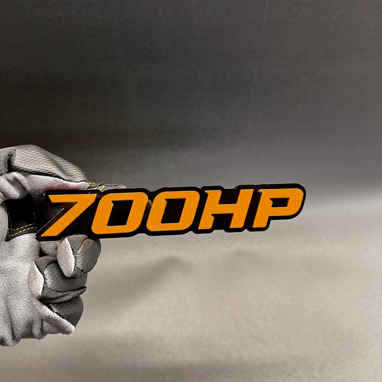 Custom 700HP car emblem in red and black performance style
