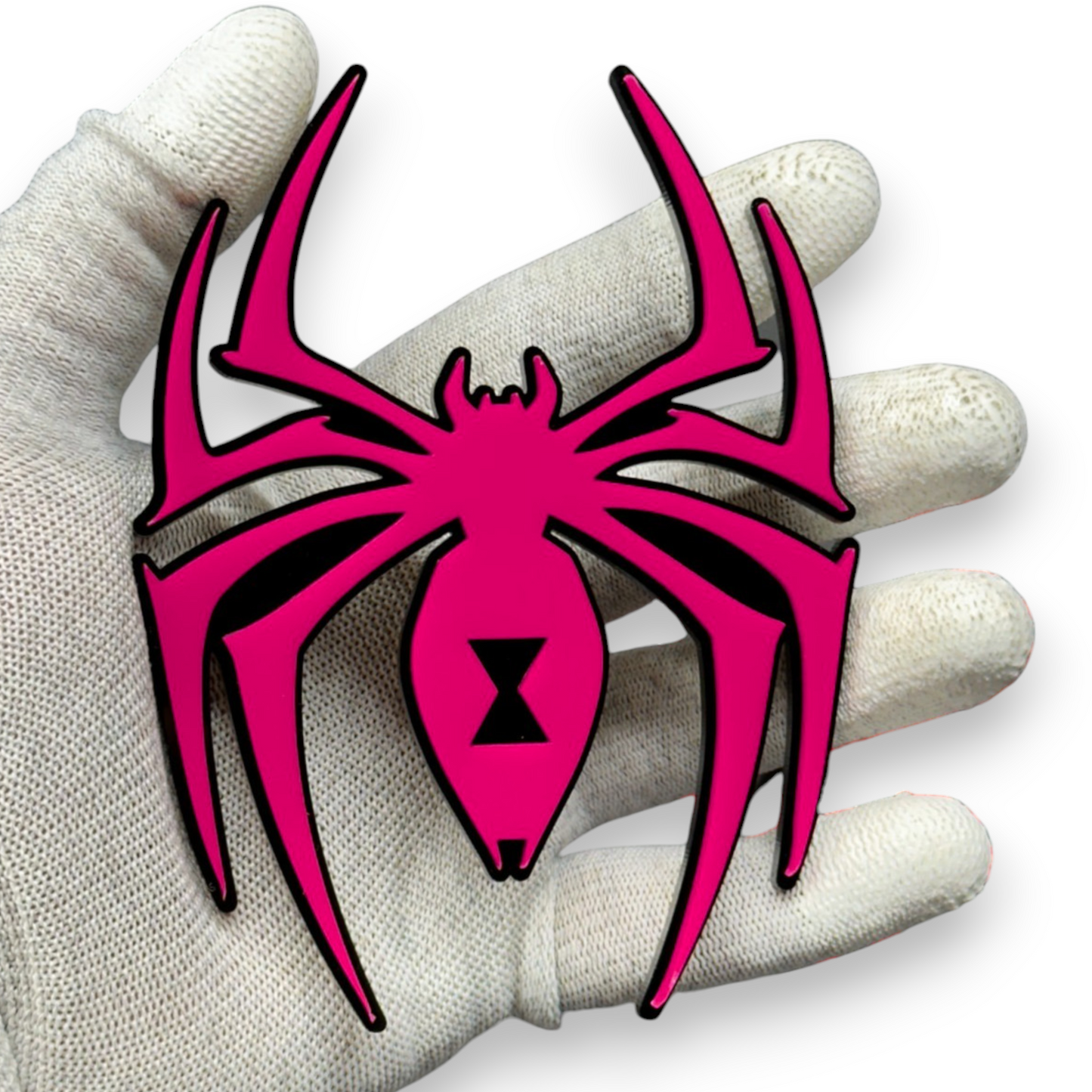 Black widow spider car badge shown on gloved hand for size reference, lightweight acrylic automotive emblem with red hourglass detail