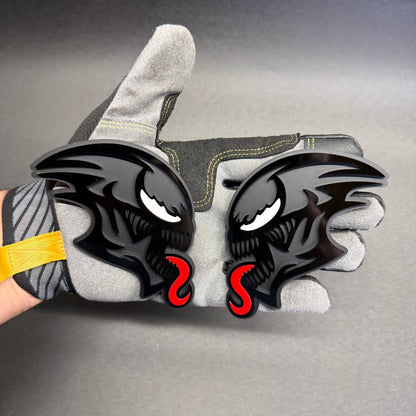 Aggressive black ALIEN monster emblem with red tongue, aftermarket decorative badge for Ford F150, GMC Sierra, Toyota Tacoma and Nissan Frontier.