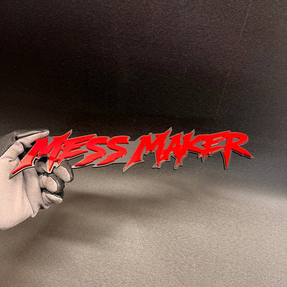 MESS MAKER exterior car badge fender emblem with bold red and black design