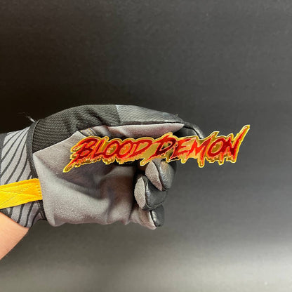 Red and gold acrylic automotive emblem with graffiti inspired dripping script lettering style