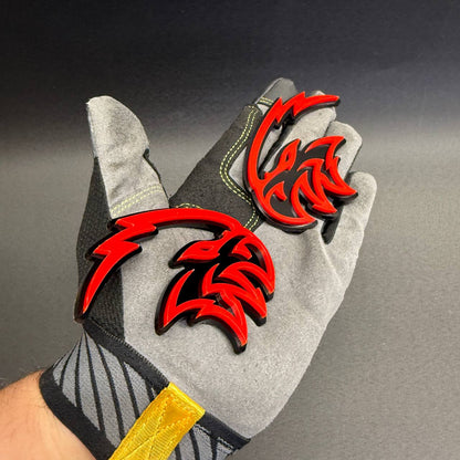 Angry Falcon red and black aftermarket fender emblem with sharp bird head graphics for Dodge Charger, Challenger and RAM truck customization.