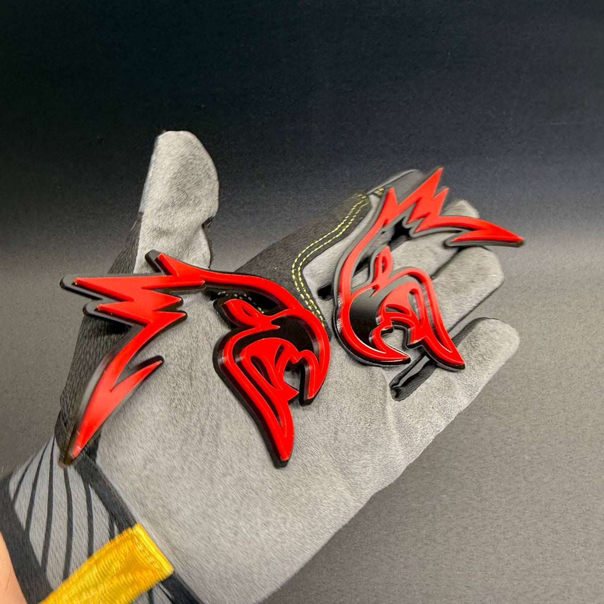 Aggressive Angry Hawk bird head badge in glossy red and black, custom automotive emblem for Jeep Wrangler, Gladiator and SUVs.