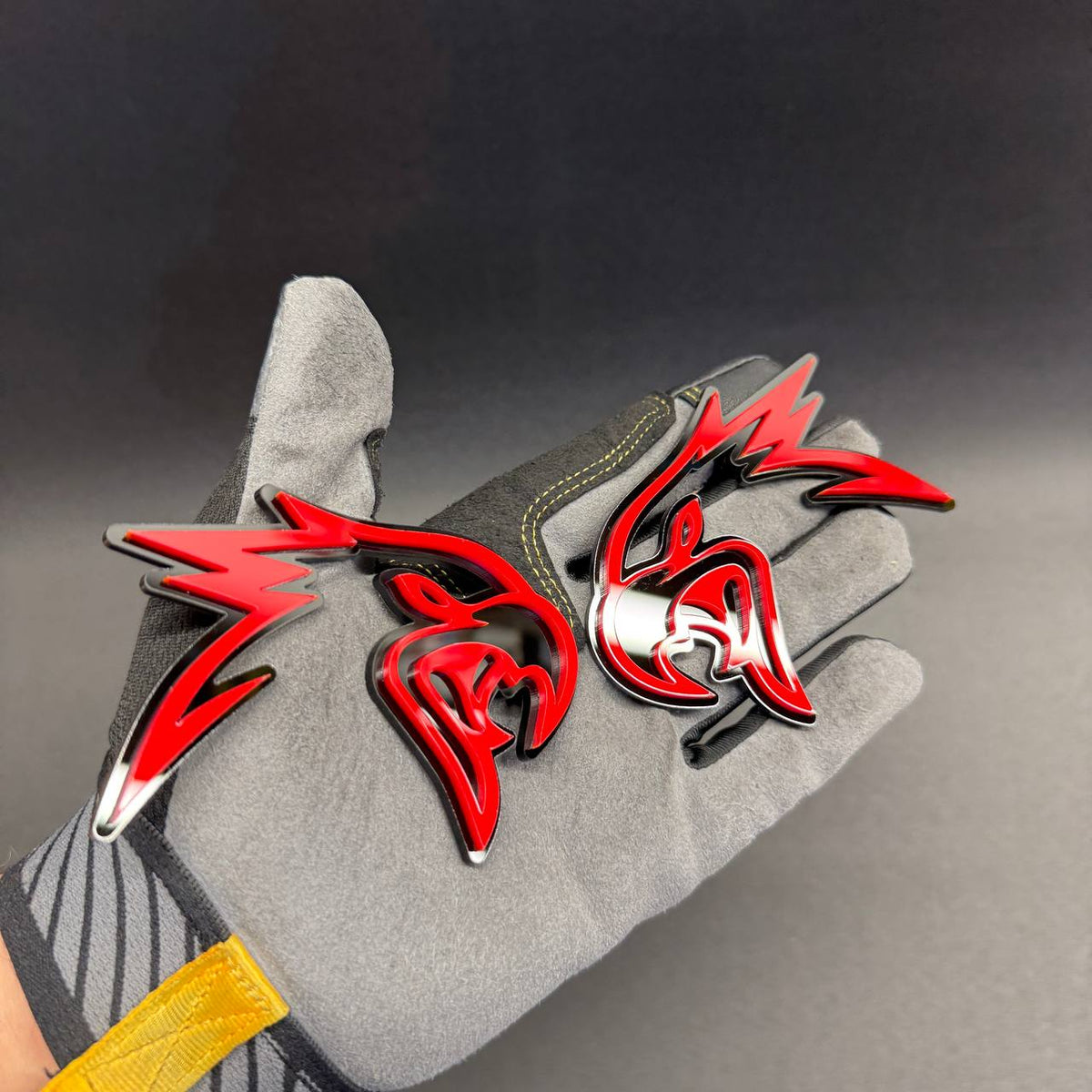 Red Angry Hawk emblem with black background, aftermarket decorative badge for Dodge Charger, Challenger, RAM trucks and muscle cars.