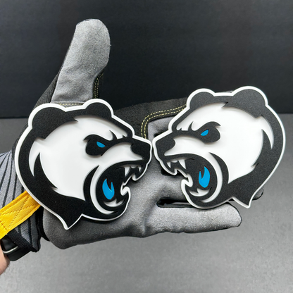 Panda head badge pair shown as custom vehicle fender emblem