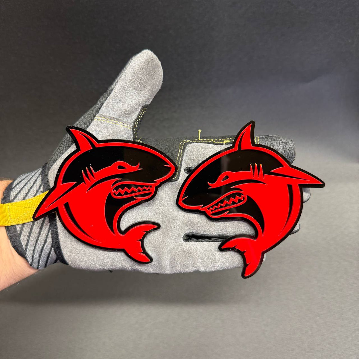 Set of two Angry Shark truck badges with aggressive red and black shark emblem design