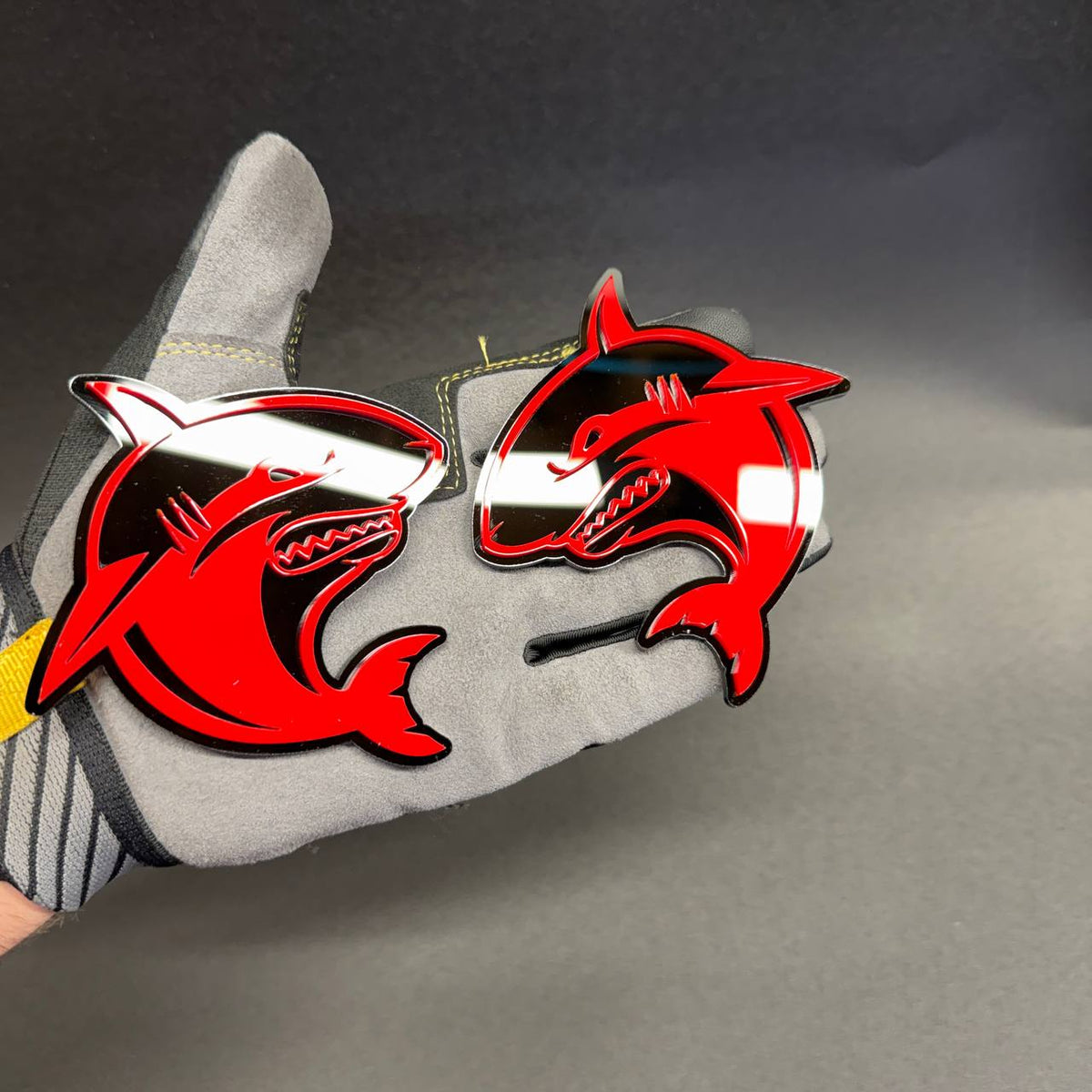 Set of two Angry Shark truck badges with aggressive red and black shark emblem design
