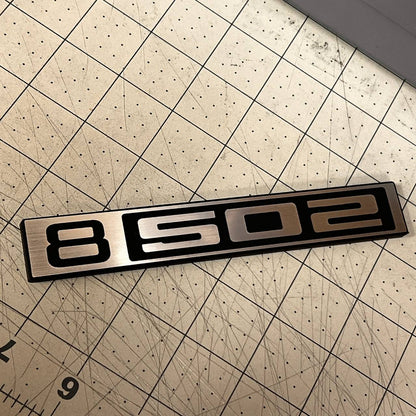 Custom front Chevy truck emblem featuring B502 lettering in silver billet finish.