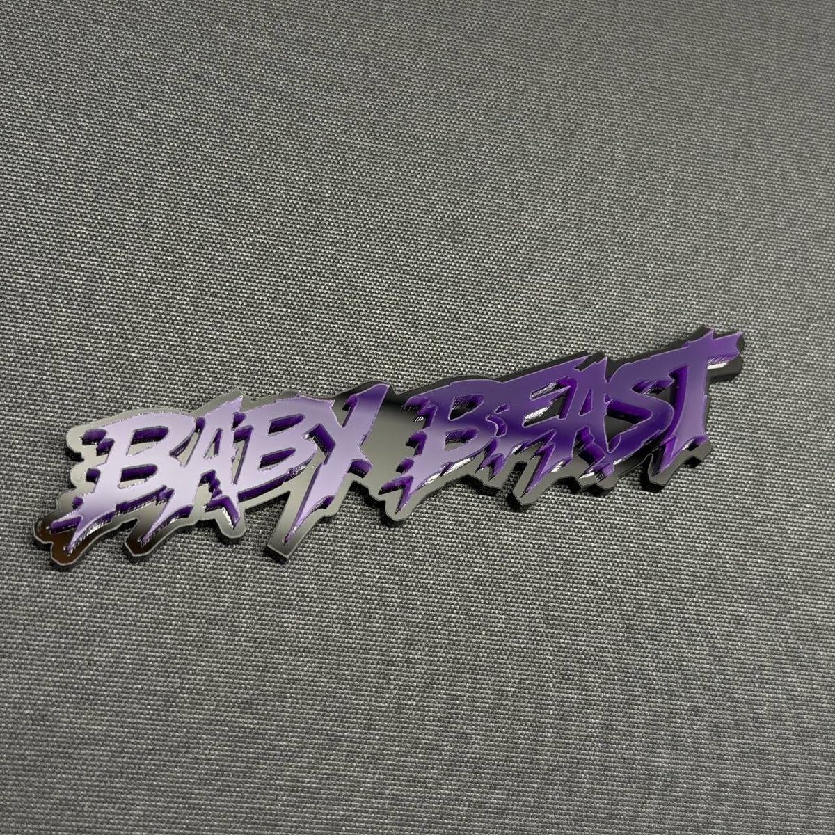 BABY BEAST custom text car badge in purple and black, 3D automotive emblem for Ford, Dodge, RAM and custom trucks.