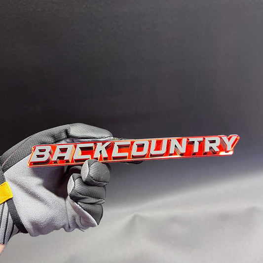 Back Country car badge fender emblem in red and silver finish