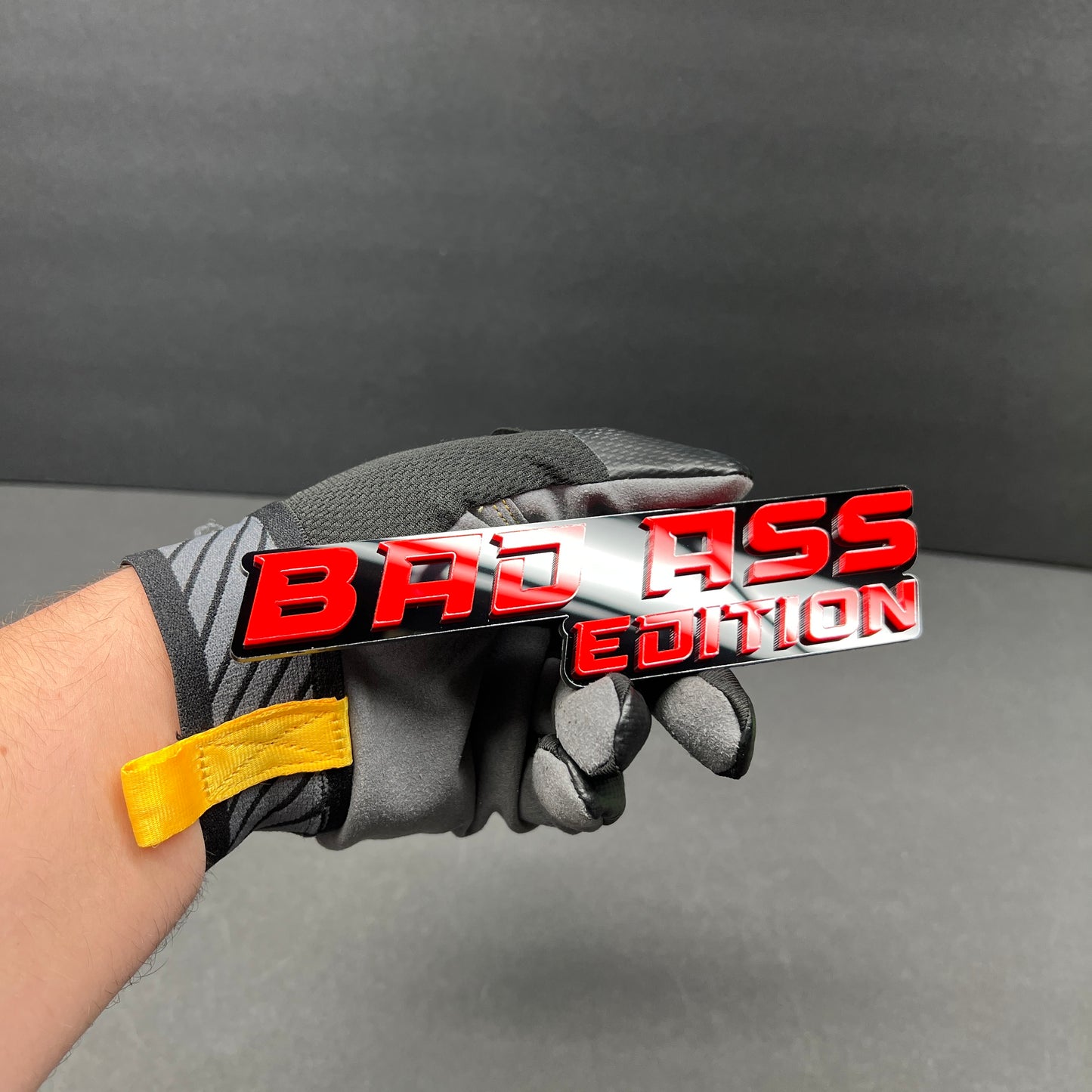 Laser-cut Bad Ass Edition acrylic vehicle badge with weather-resistant finish.