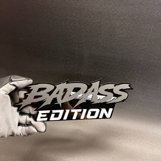 Badass Edition custom car badge in silver and black for vehicle fender or tailgate.