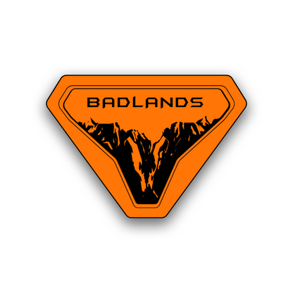 Badlands engraving fender badge with rugged mountain landscape design